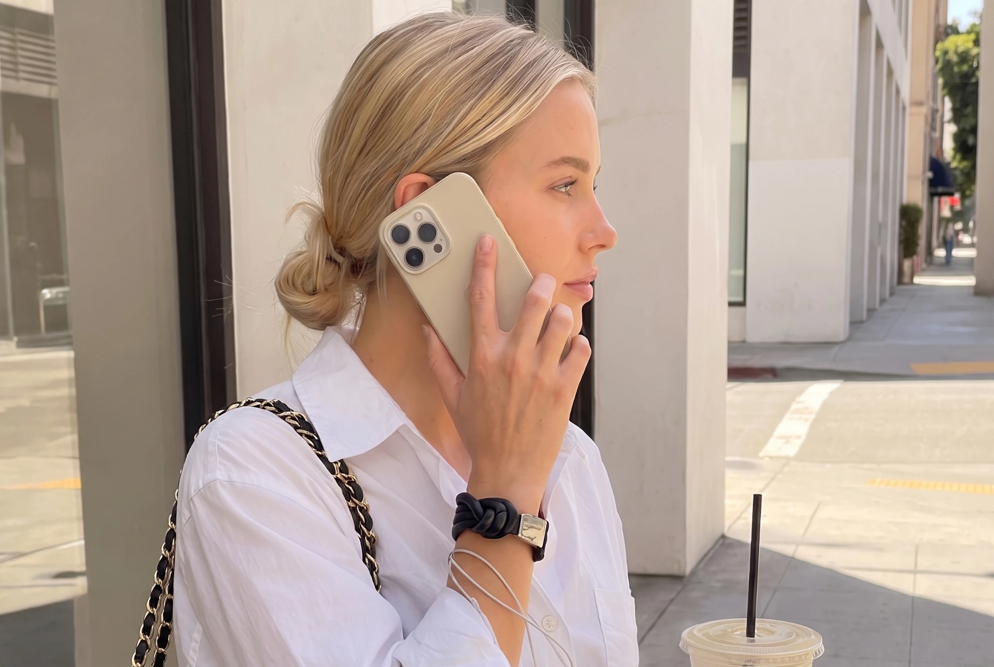 A phone resting screen-up on a warm stone surface in soft light, does your phone cause acne